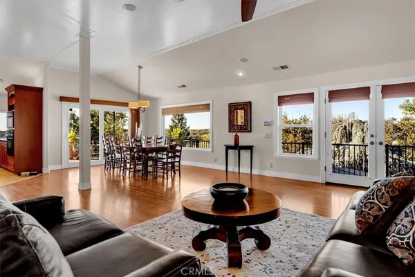 a kitchen with stainless steel appliances granite countertop a sink a stove and a refrigerator