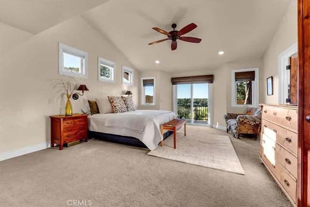 a bedroom with furniture and large window