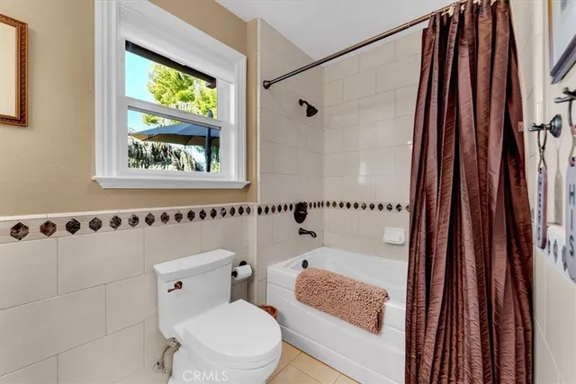 a living room with furniture and a book shelf