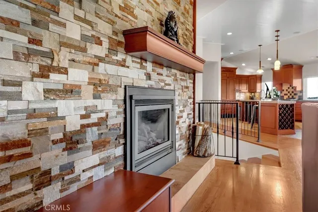 a kitchen with granite countertop a sink and a refrigerator