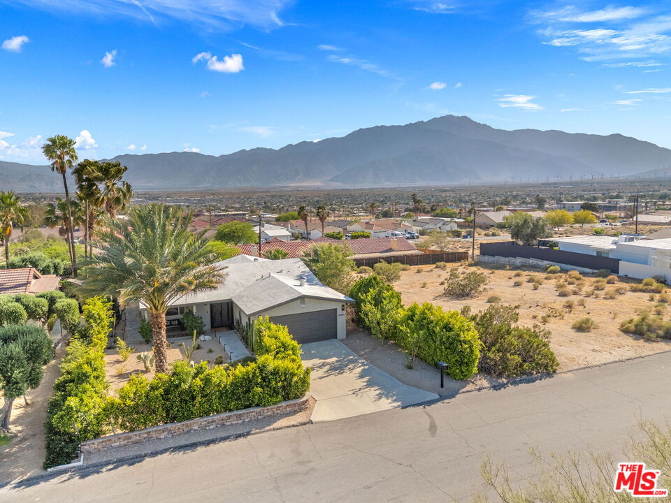 66869 San Ardo Road Desert Hot Springs, CA 92240 - Photo 10 of 39 a aerial view of a house with a garden