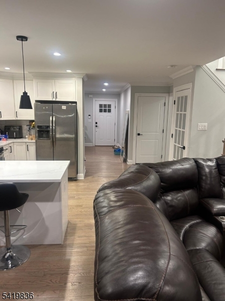 15-17 Rector Avenue Woodbridge, NJ 07095 - Photo 15 of 33 a living room with furniture and kitchen view