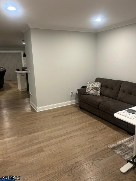 15-17 Rector Avenue Woodbridge, NJ 07095 - Photo 2 of 33 a living room with furniture and a wooden floor