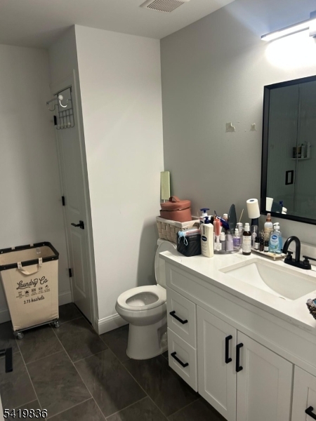 15-17 Rector Avenue Woodbridge, NJ 07095 - Photo 22 of 33 a bathroom with a sink toilet and shower