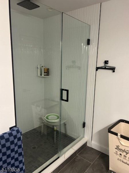 15-17 Rector Avenue Woodbridge, NJ 07095 - Photo 23 of 33 a bathroom with a toilet and a shower