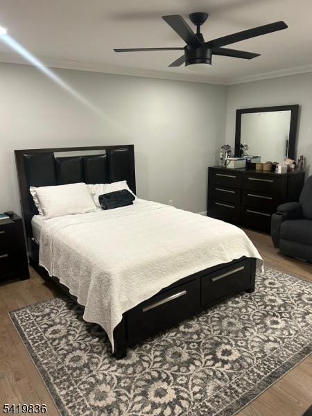 15-17 Rector Avenue Woodbridge, NJ 07095 - Photo 25 of 33 a bedroom with a bed and a dresser