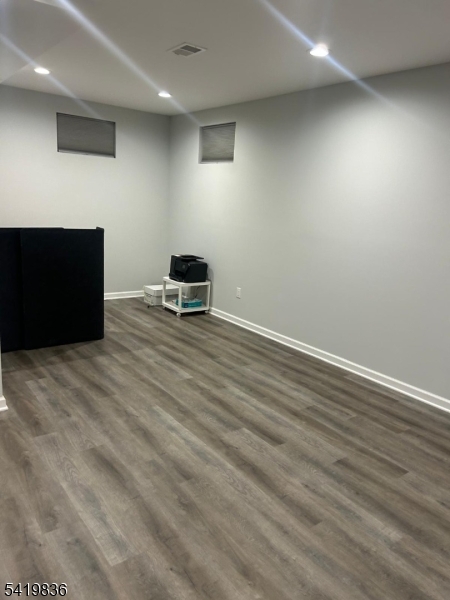 15-17 Rector Avenue Woodbridge, NJ 07095 - Photo 27 of 33 an empty room with wooden floor