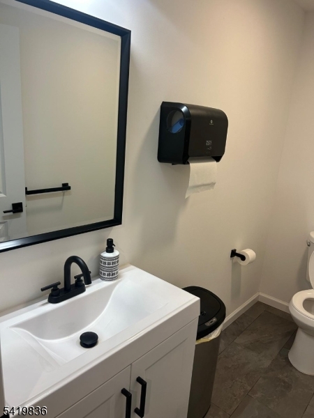 15-17 Rector Avenue Woodbridge, NJ 07095 - Photo 30 of 33 a bathroom with a sink and a mirror