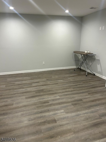 15-17 Rector Avenue Woodbridge, NJ 07095 - Photo 31 of 33 a view of an empty room with wooden floor