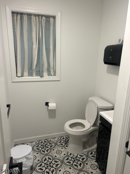 15-17 Rector Avenue Woodbridge, NJ 07095 - Photo 6 of 33 a bathroom with a toilet and a shower
