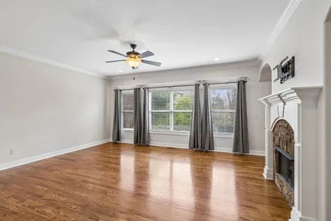 a open kitchen with stainless steel appliances granite countertop a refrigerator stove top oven and sink