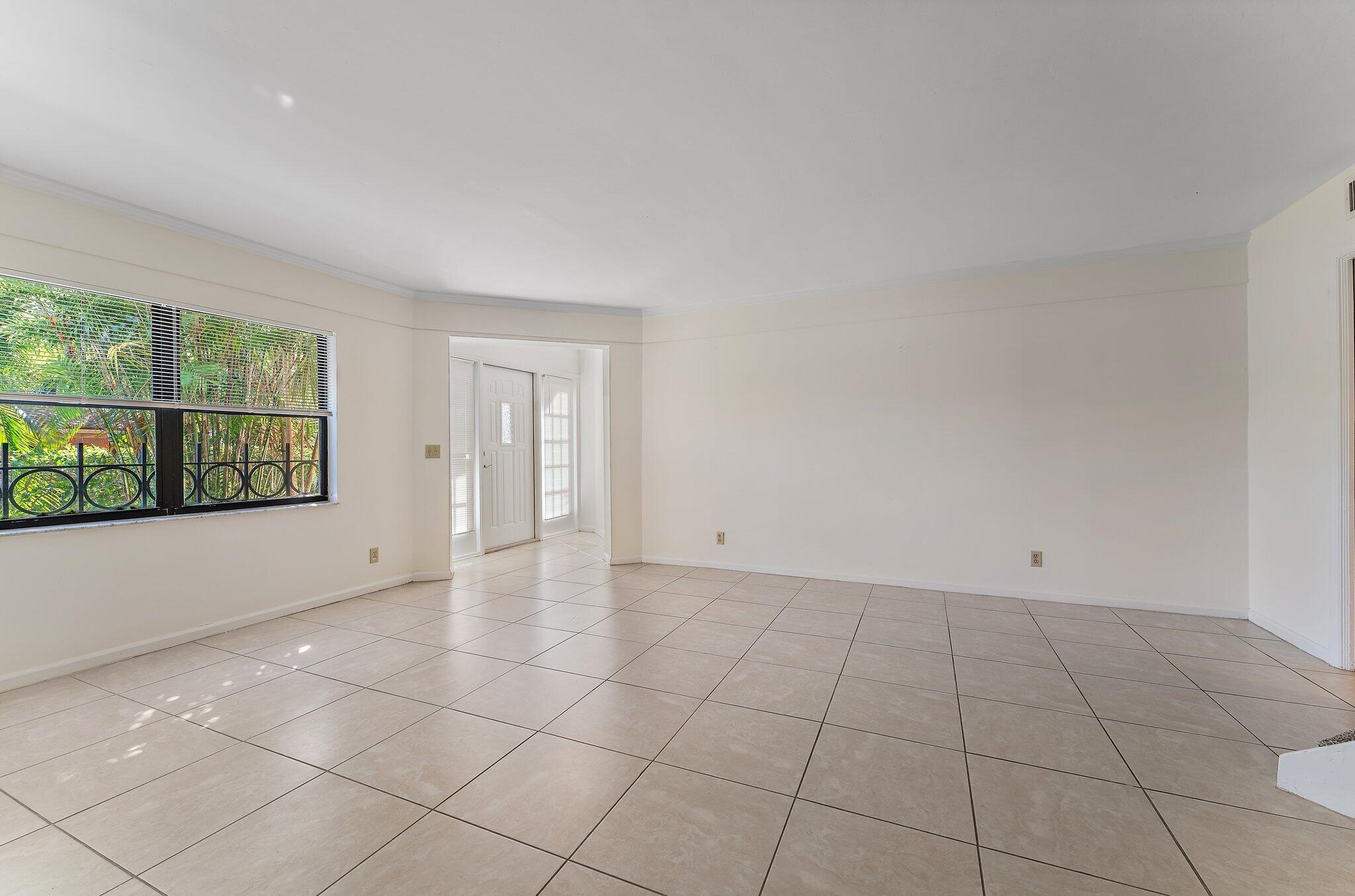 3 Uno Lago Drive, Unit 3 Juno Beach, FL 33408 - Photo 11 of 31 a view of an empty room with a window