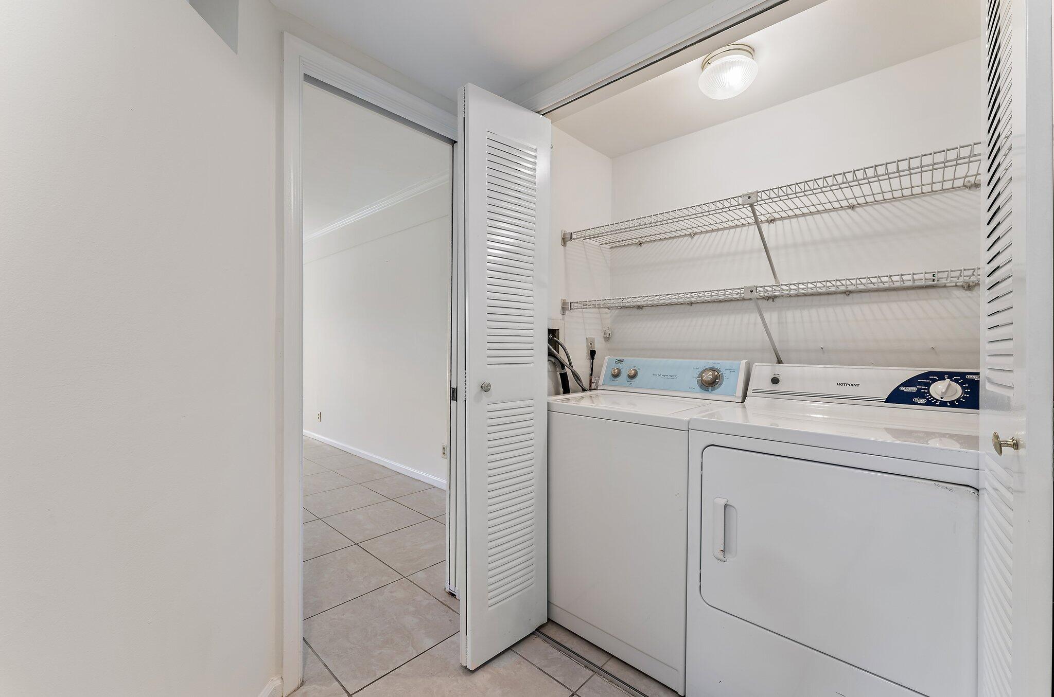 3 Uno Lago Drive, Unit 3 Juno Beach, FL 33408 - Photo 13 of 31 a utility room with dryer and washer