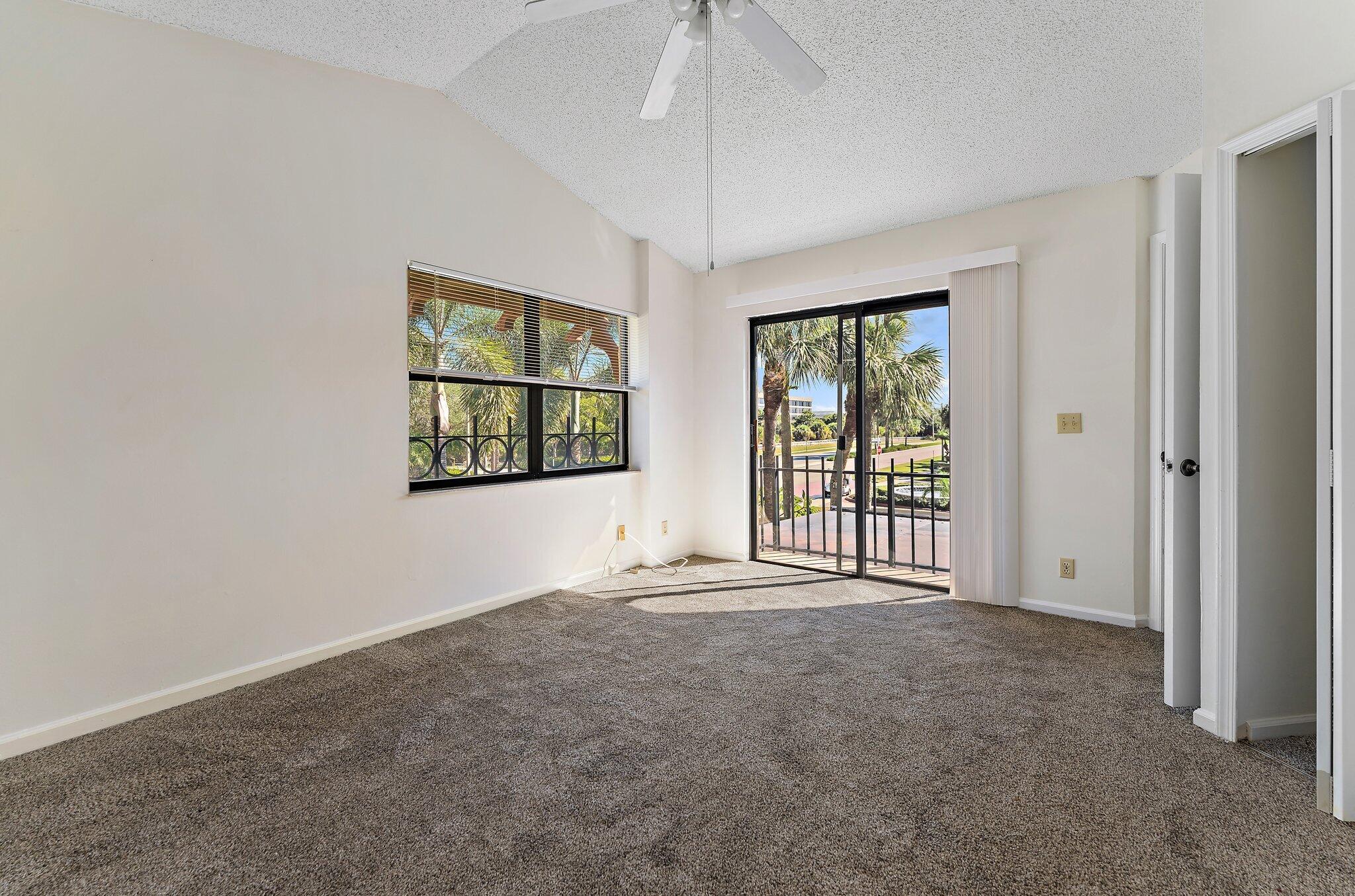 3 Uno Lago Drive, Unit 3 Juno Beach, FL 33408 - Photo 21 of 31 an empty room with windows
