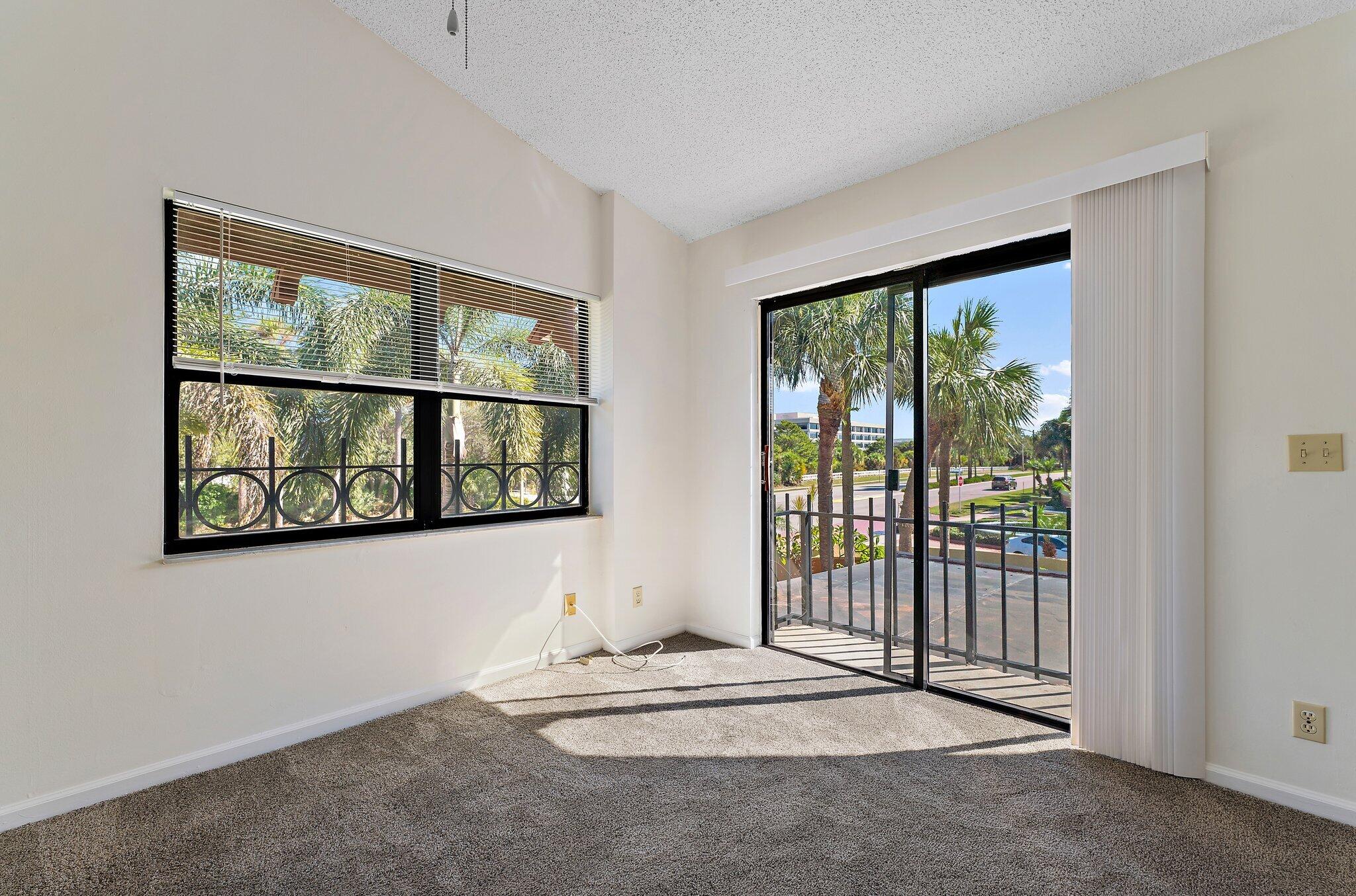 3 Uno Lago Drive, Unit 3 Juno Beach, FL 33408 - Photo 23 of 31 a view of a large window with an outdoor space