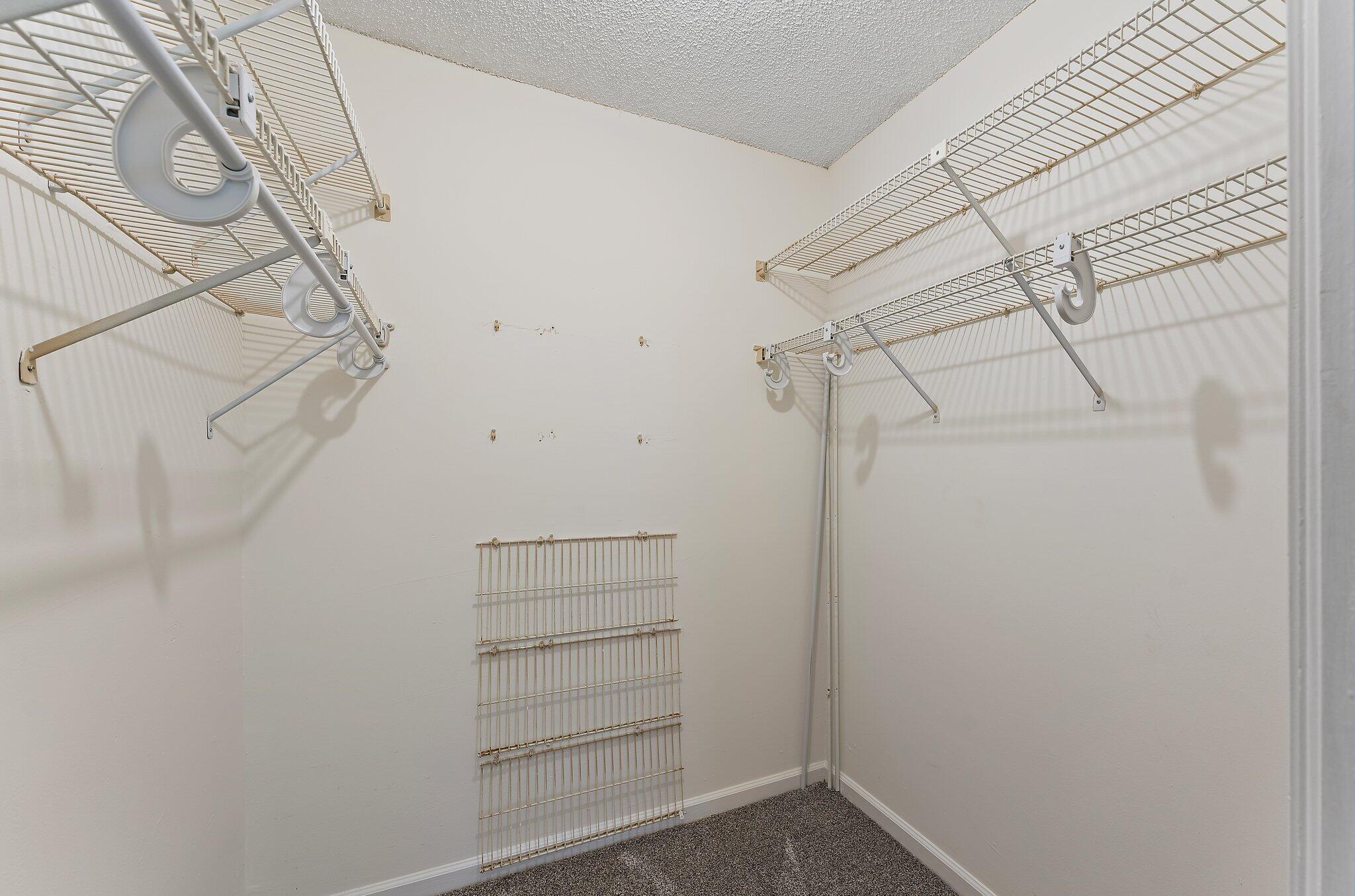 3 Uno Lago Drive, Unit 3 Juno Beach, FL 33408 - Photo 25 of 31 a view of a room with racks on the wall