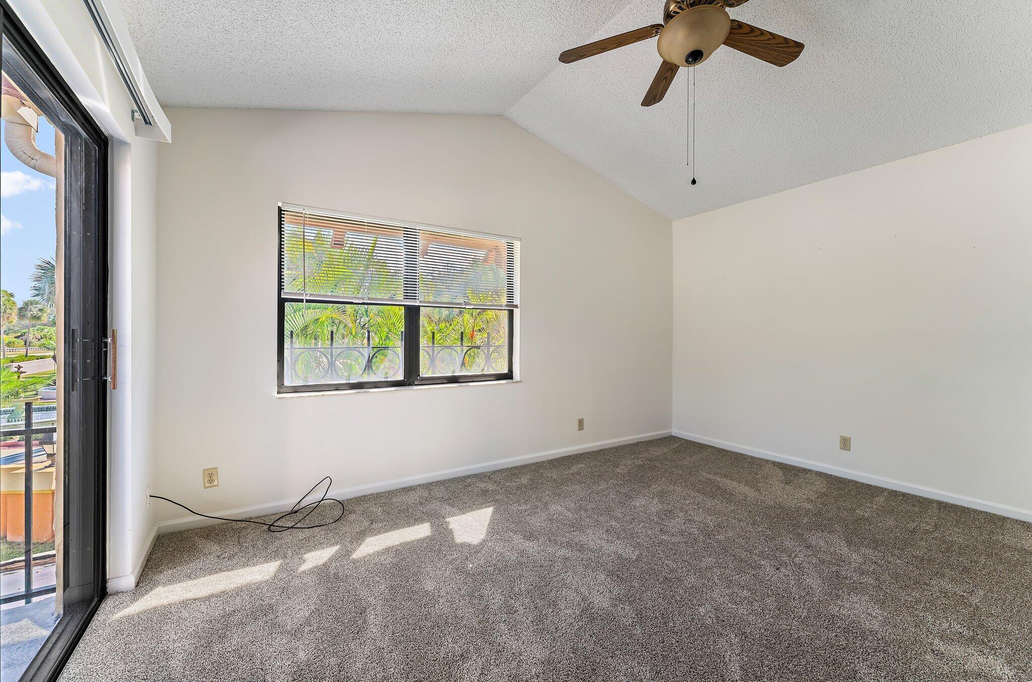 3 Uno Lago Drive, Unit 3 Juno Beach, FL 33408 - Photo 27 of 31 an empty room with a window