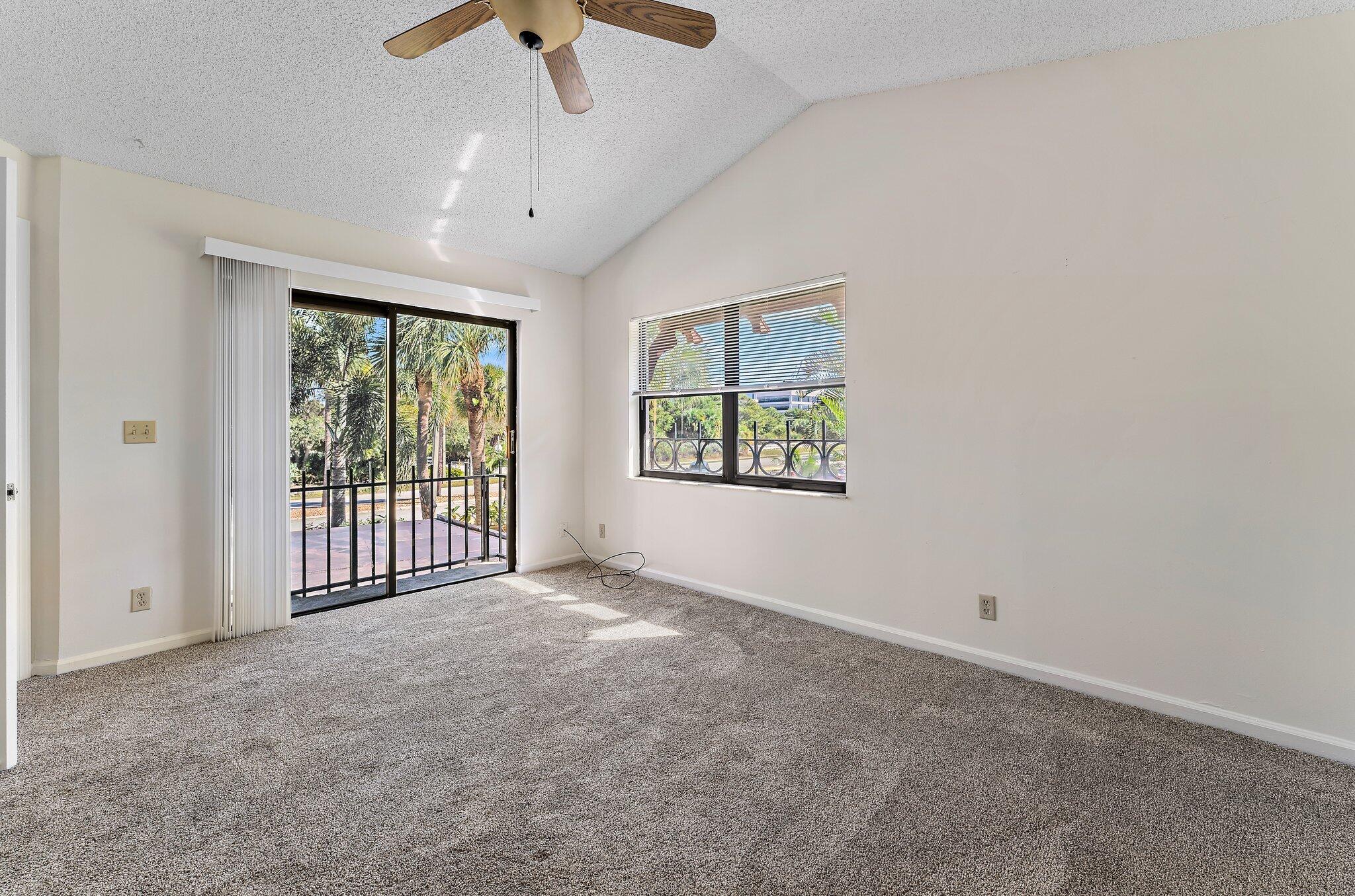 3 Uno Lago Drive, Unit 3 Juno Beach, FL 33408 - Photo 28 of 31 a view of an empty room with a window