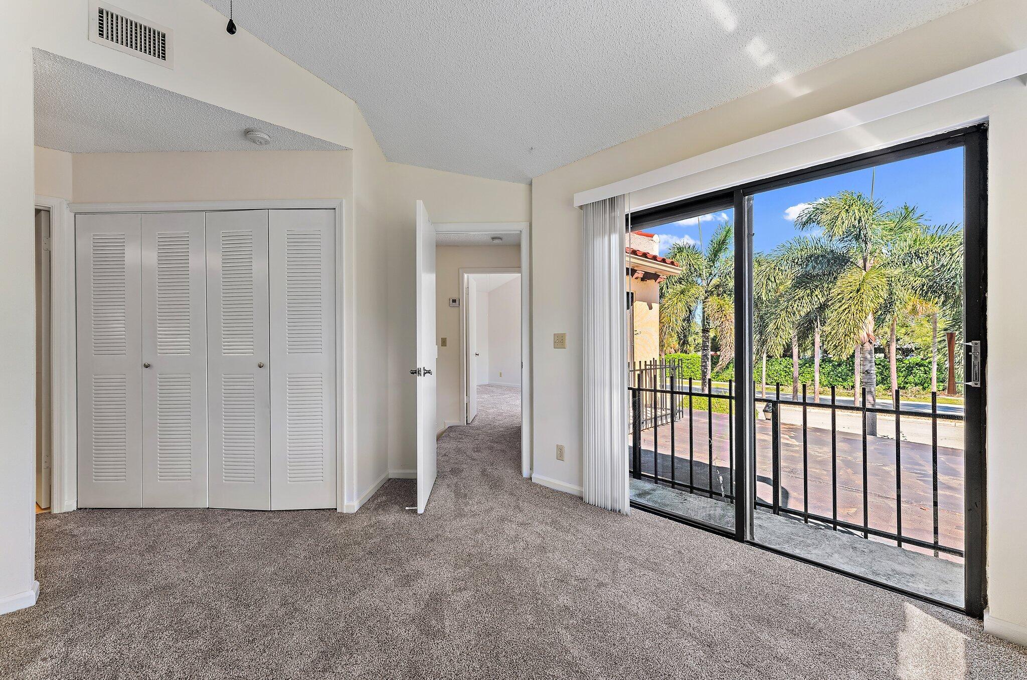 3 Uno Lago Drive, Unit 3 Juno Beach, FL 33408 - Photo 29 of 31 a view of empty room with floor to ceiling window