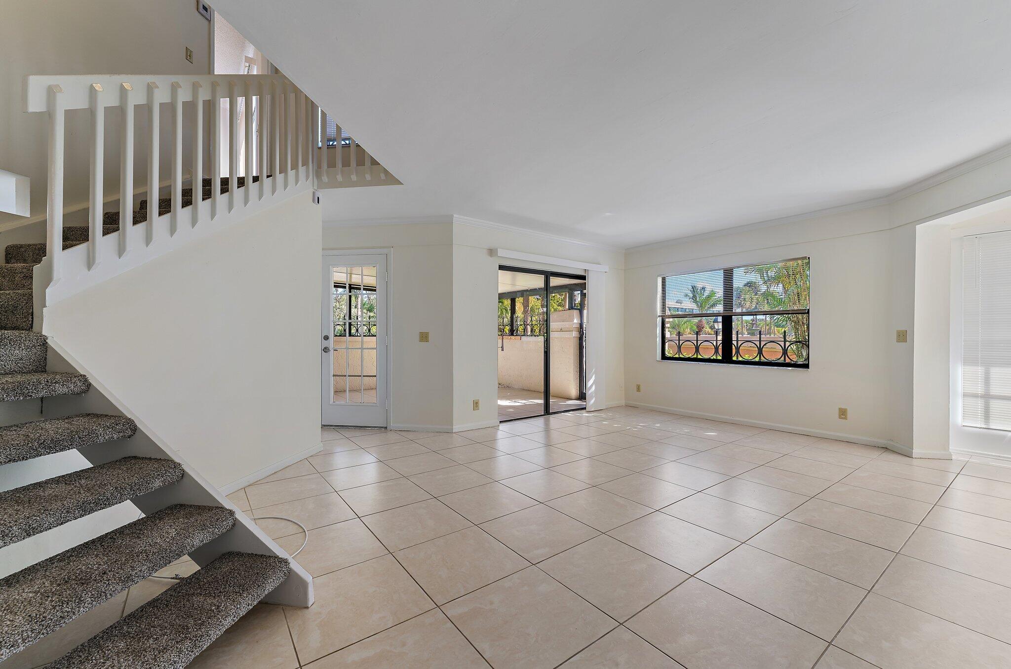 3 Uno Lago Drive, Unit 3 Juno Beach, FL 33408 - Photo 9 of 31 an empty room with windows