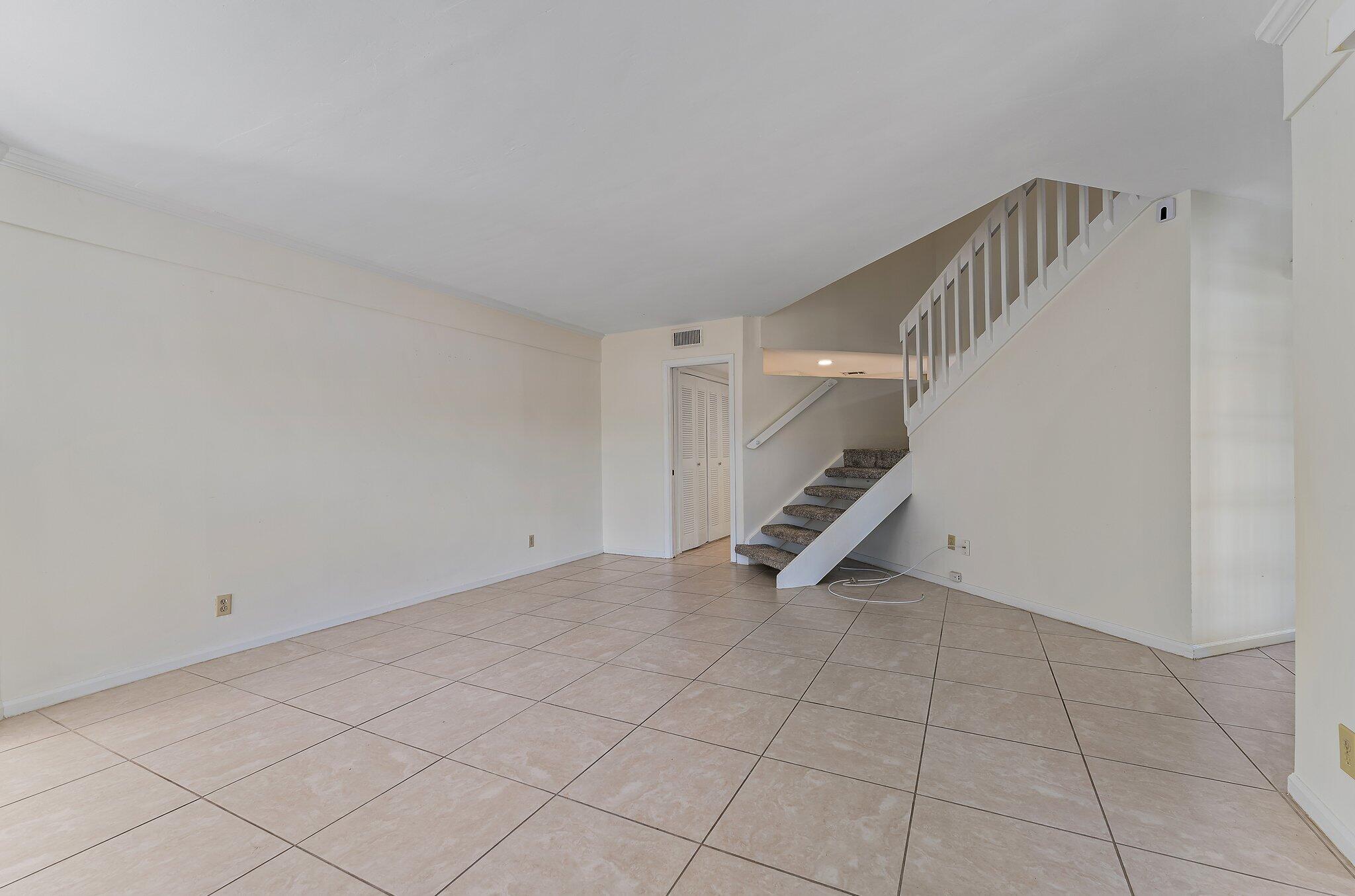 3 Uno Lago Drive, Unit 3 Juno Beach, FL 33408 - Photo 10 of 31 a view of an entryway with stairs
