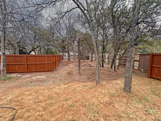 a backyard of a house with lots of green space
