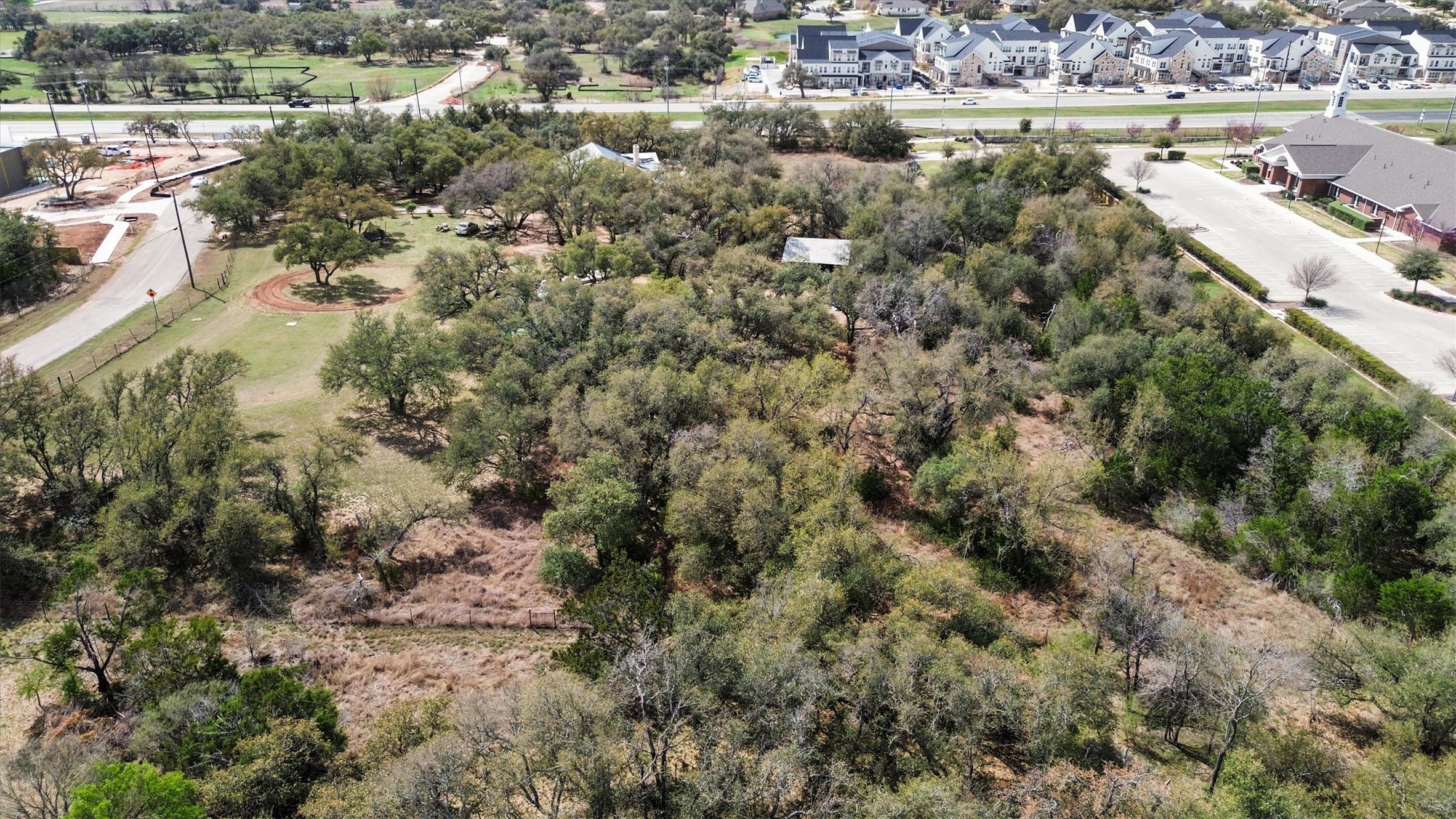 51 County Road 264 Leander, TX 78641 - Photo 8 of 15 an aerial view of residential houses with outdoor space and trees