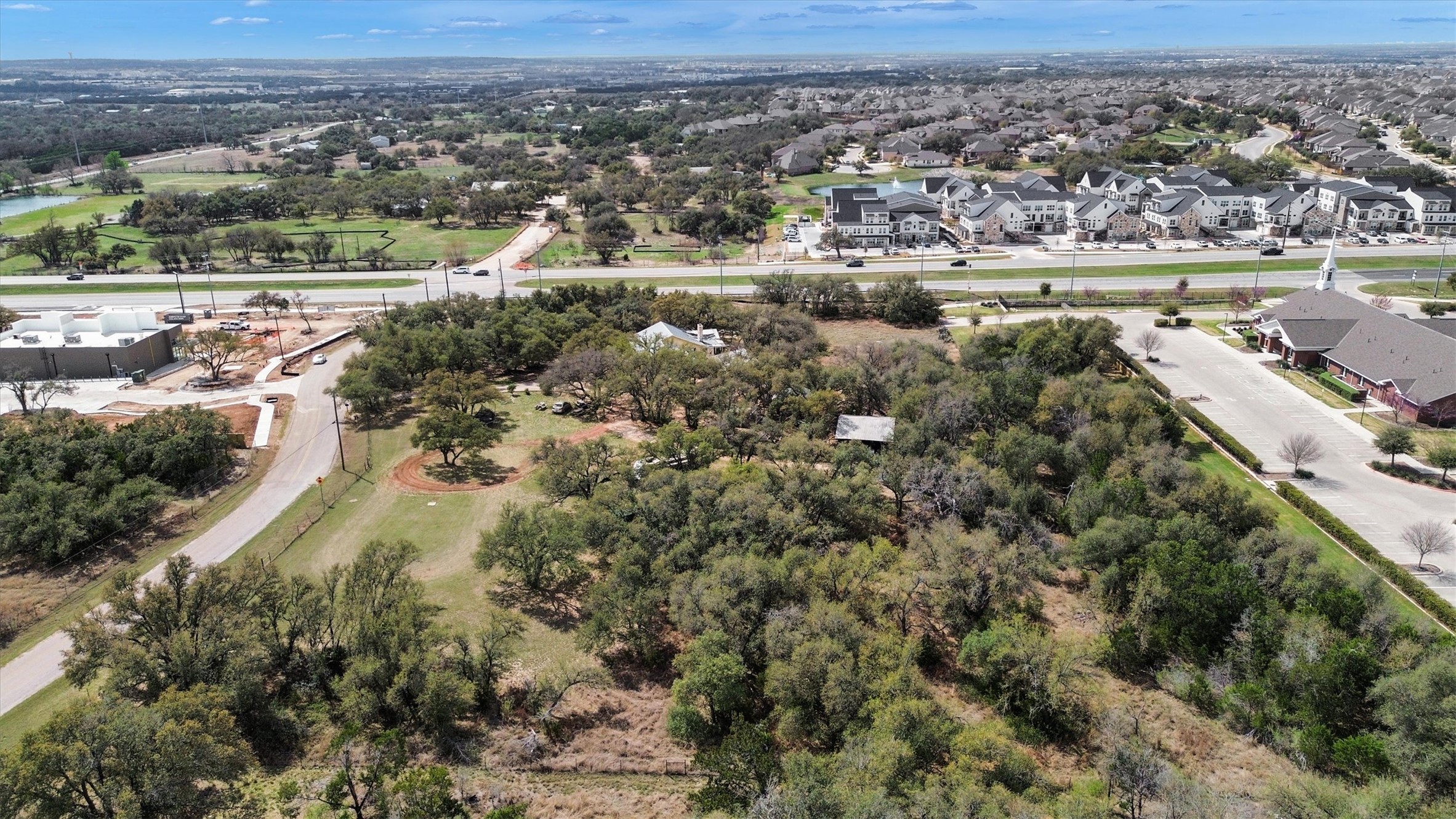 51 County Road 264 Leander, TX 78641 - Photo 9 of 15 an aerial view of a city with mountains