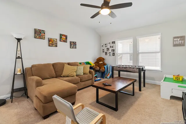 a living room with furniture and a window