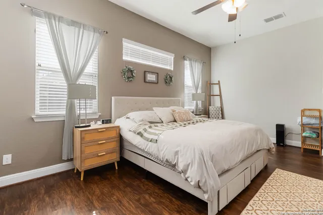 a bedroom with bed and window