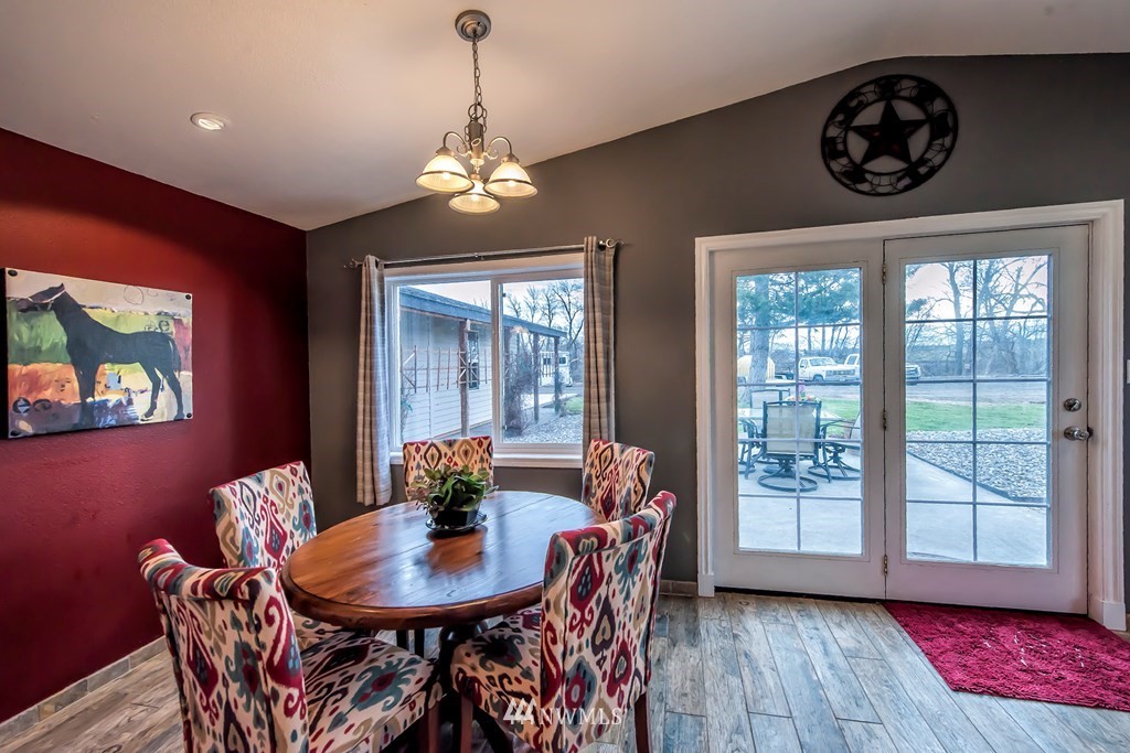 126 Last Chance Road Walla Walla, WA 99362 - Photo 8 of 40 a dining room with furniture a chandelier and wooden floor