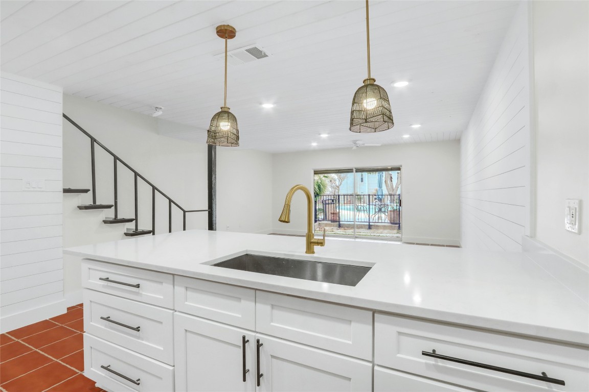 551 Terminal Loop Road, Unit B3 McQueeney, TX 78123 - Photo 10 of 23 a kitchen with a sink and chandelier