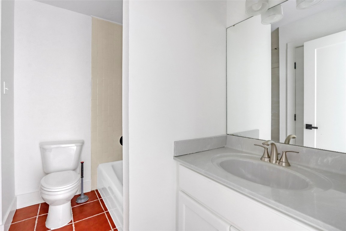 551 Terminal Loop Road, Unit B3 McQueeney, TX 78123 - Photo 20 of 23 a bathroom with a sink and a toilet