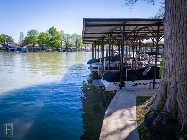 a view of a house with swimming pool having outdoor seating