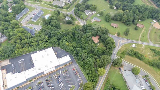 an aerial view of a house with outdoor space