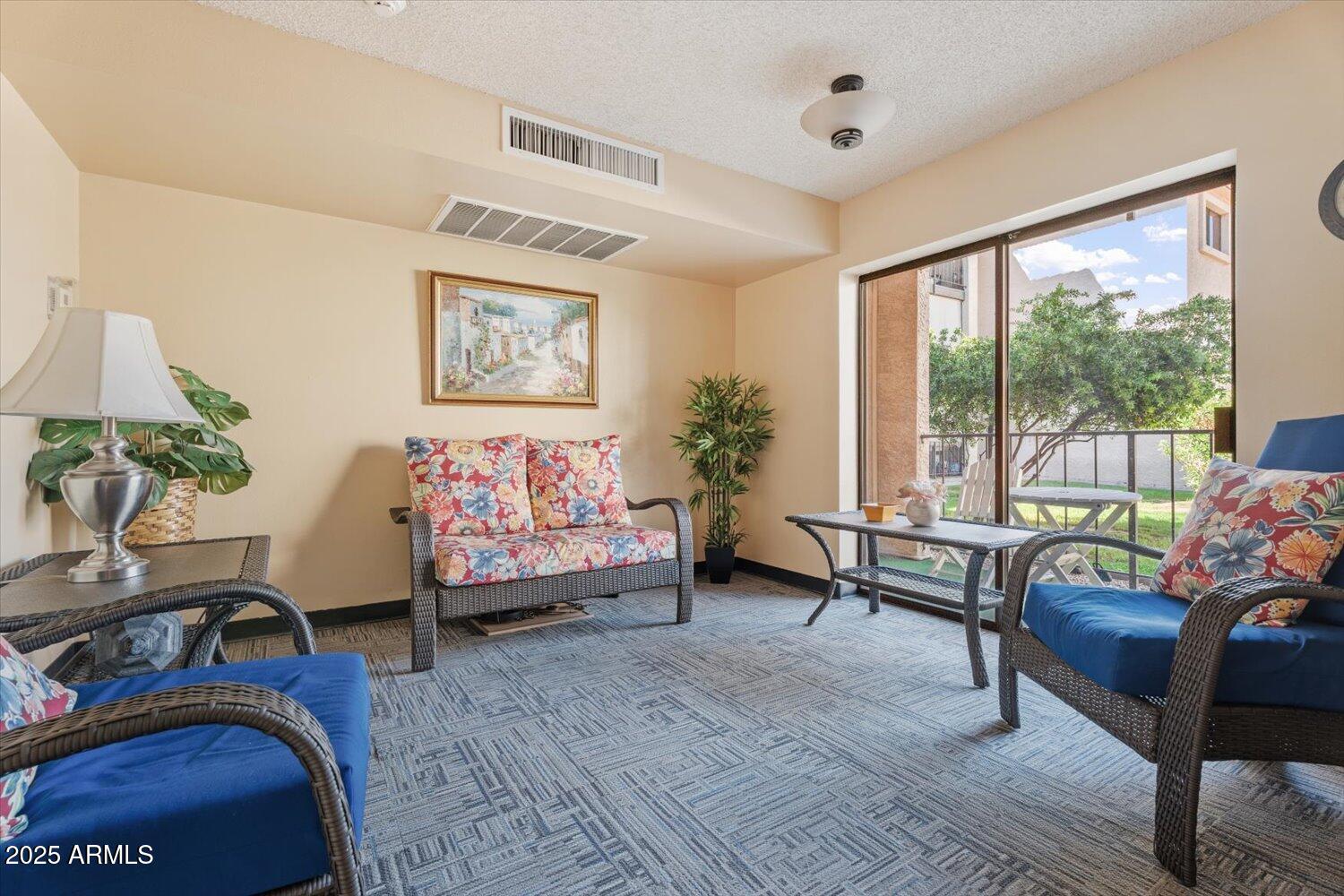 3033 East Devonshire Avenue, Unit 2003 Phoenix, AZ 85016 - Photo 21 of 32 a view of a livingroom with furniture and lounge chair