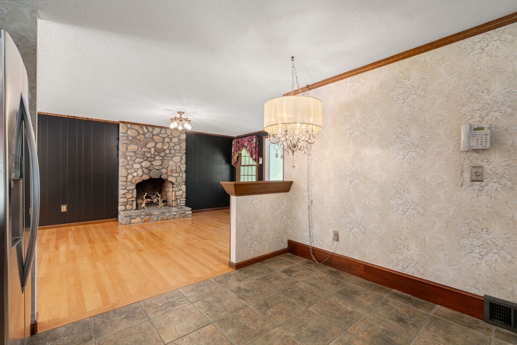 2035 Parker Street Springfield, MA 01128 - Photo 16 of 42 a view of a livingroom with a fireplace