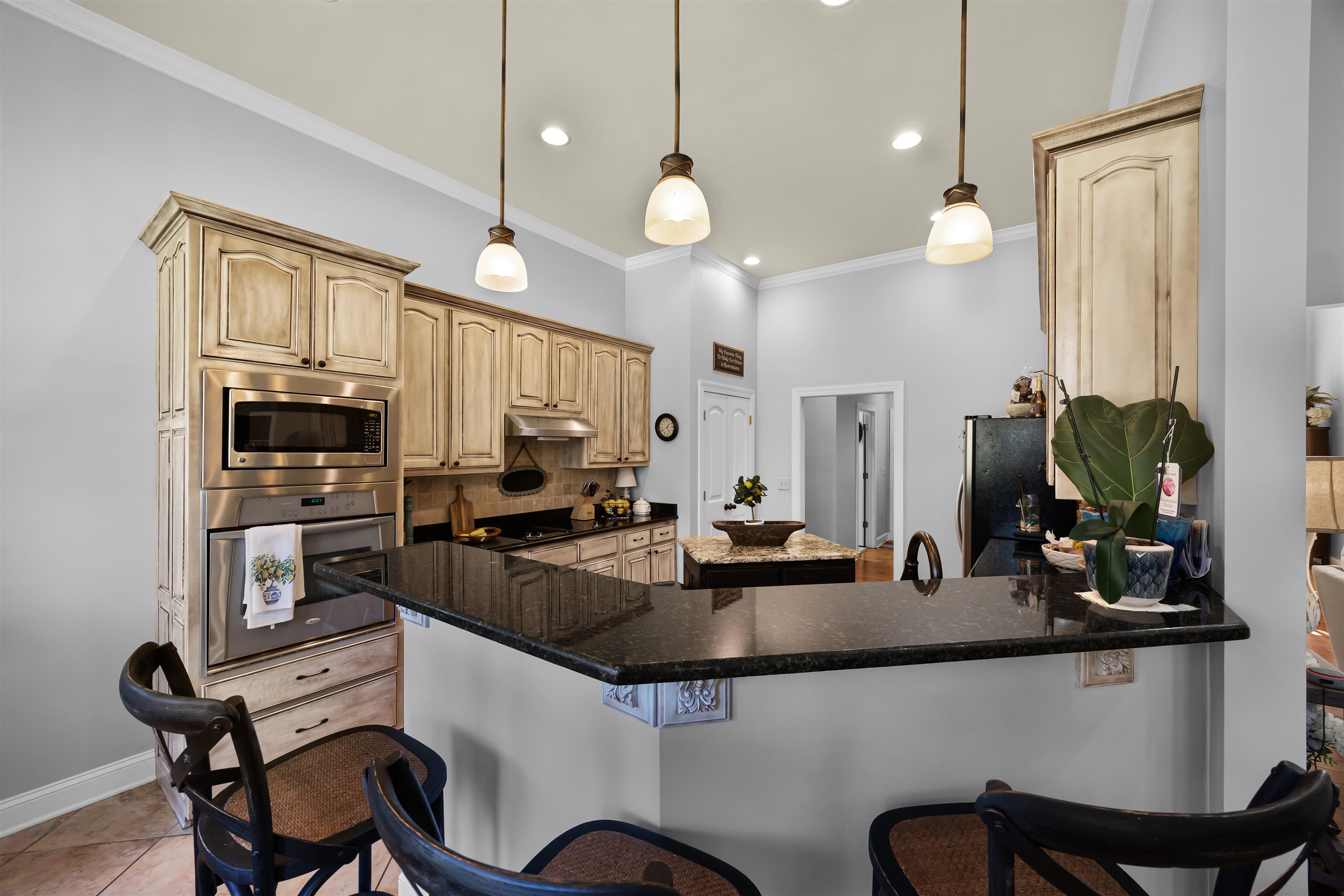 140 Legends Drive Counce, TN 38326 - Photo 11 of 30 a kitchen with cabinets a sink appliances and chairs