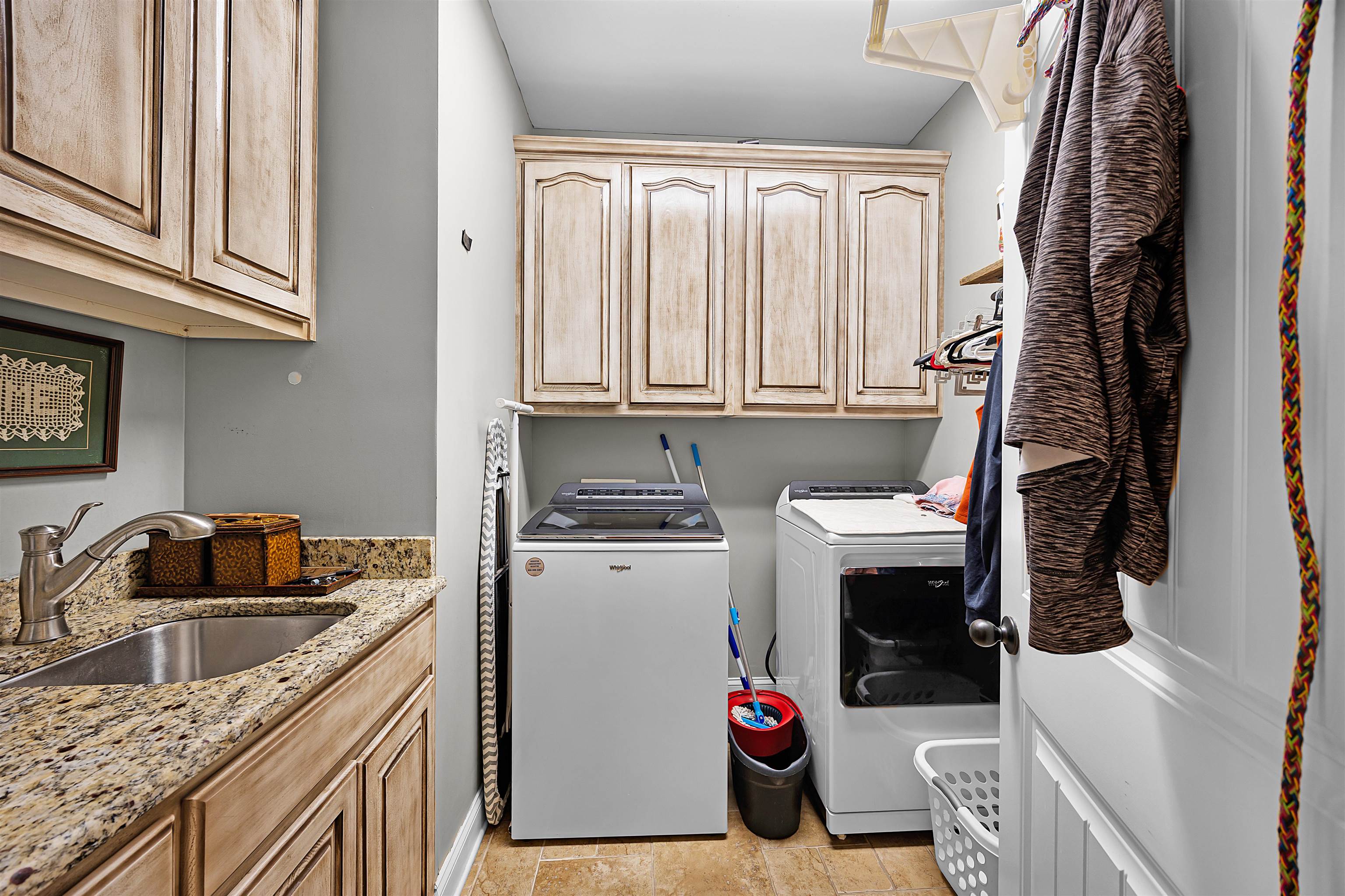 140 Legends Drive Counce, TN 38326 - Photo 23 of 30 a kitchen with a sink cabinets and washer