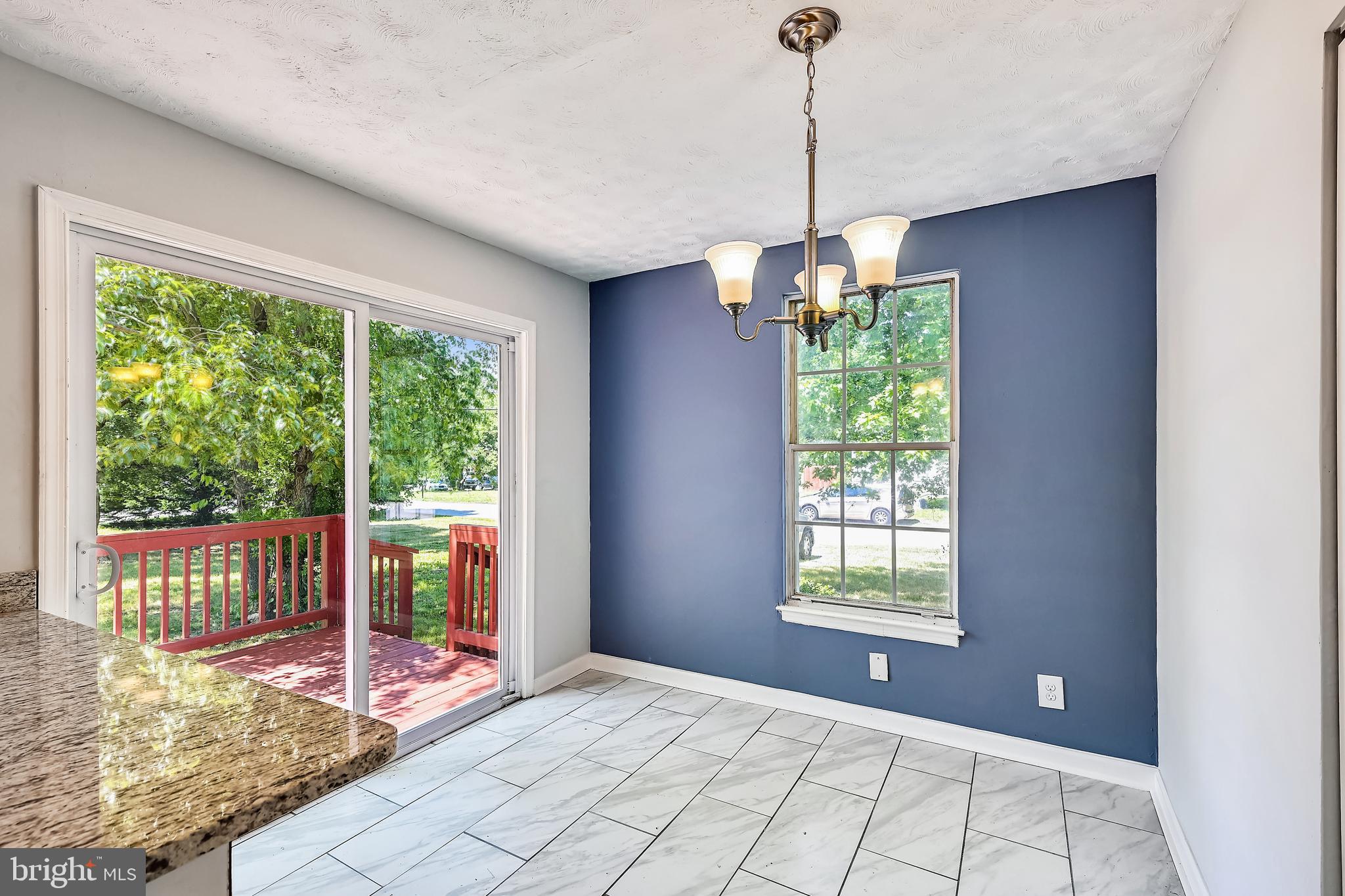 8360 Lockwood Road Pasadena, MD 21122 - Photo 22 of 44 Dining room with sliders to deck