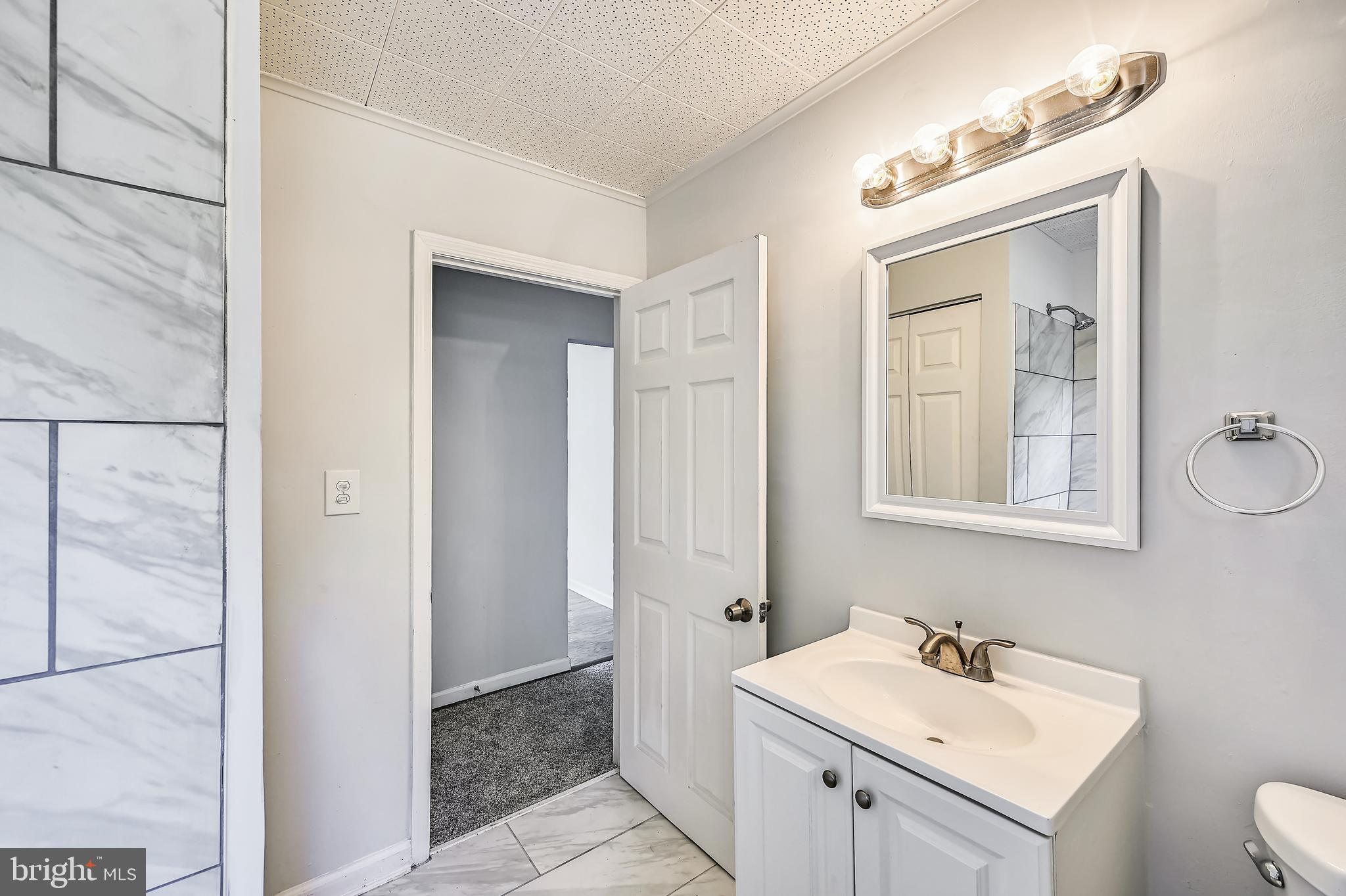 8360 Lockwood Road Pasadena, MD 21122 - Photo 31 of 44 Full Bath 1
