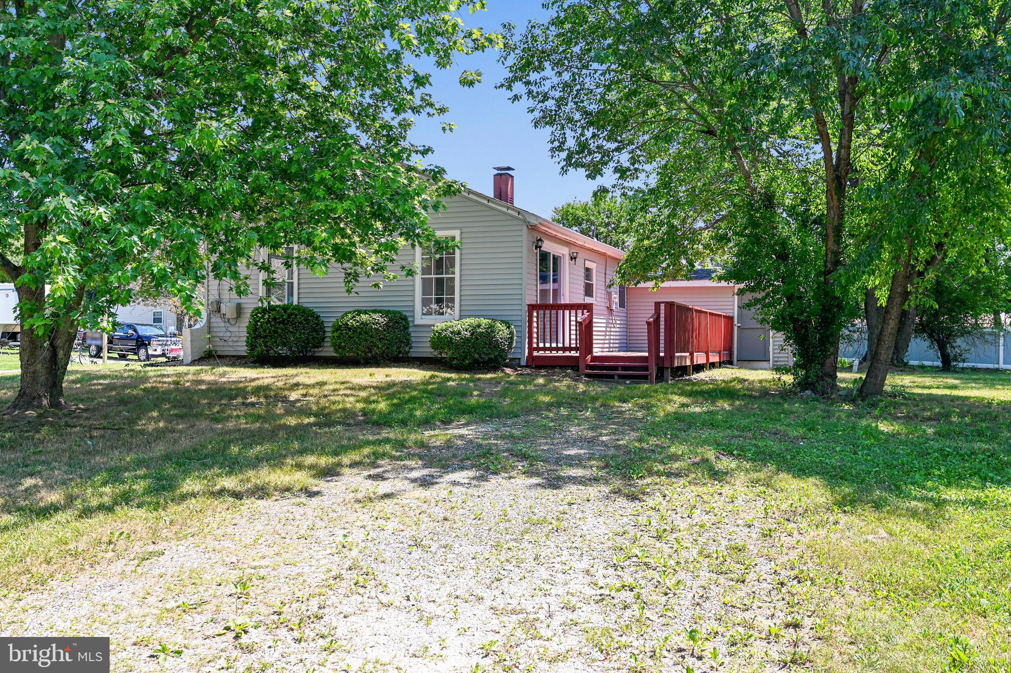 8360 Lockwood Road Pasadena, MD 21122 - Photo 6 of 44 Right side, gravel driveway and deck