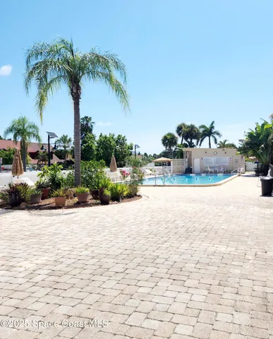 a view of a swimming pool and a chair