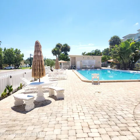 a view of a swimming pool and a yard