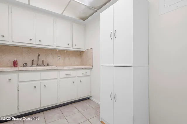 a kitchen with cabinets and appliances