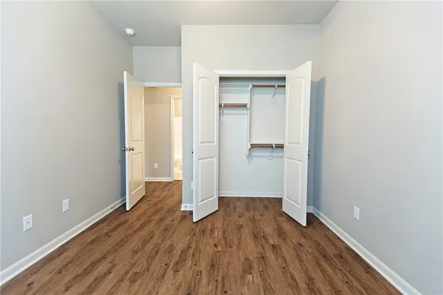 a view of kitchen with kitchen island stainless steel appliances a sink and a stove