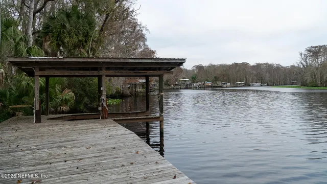 a backyard of a house with lots of green space and mountain view