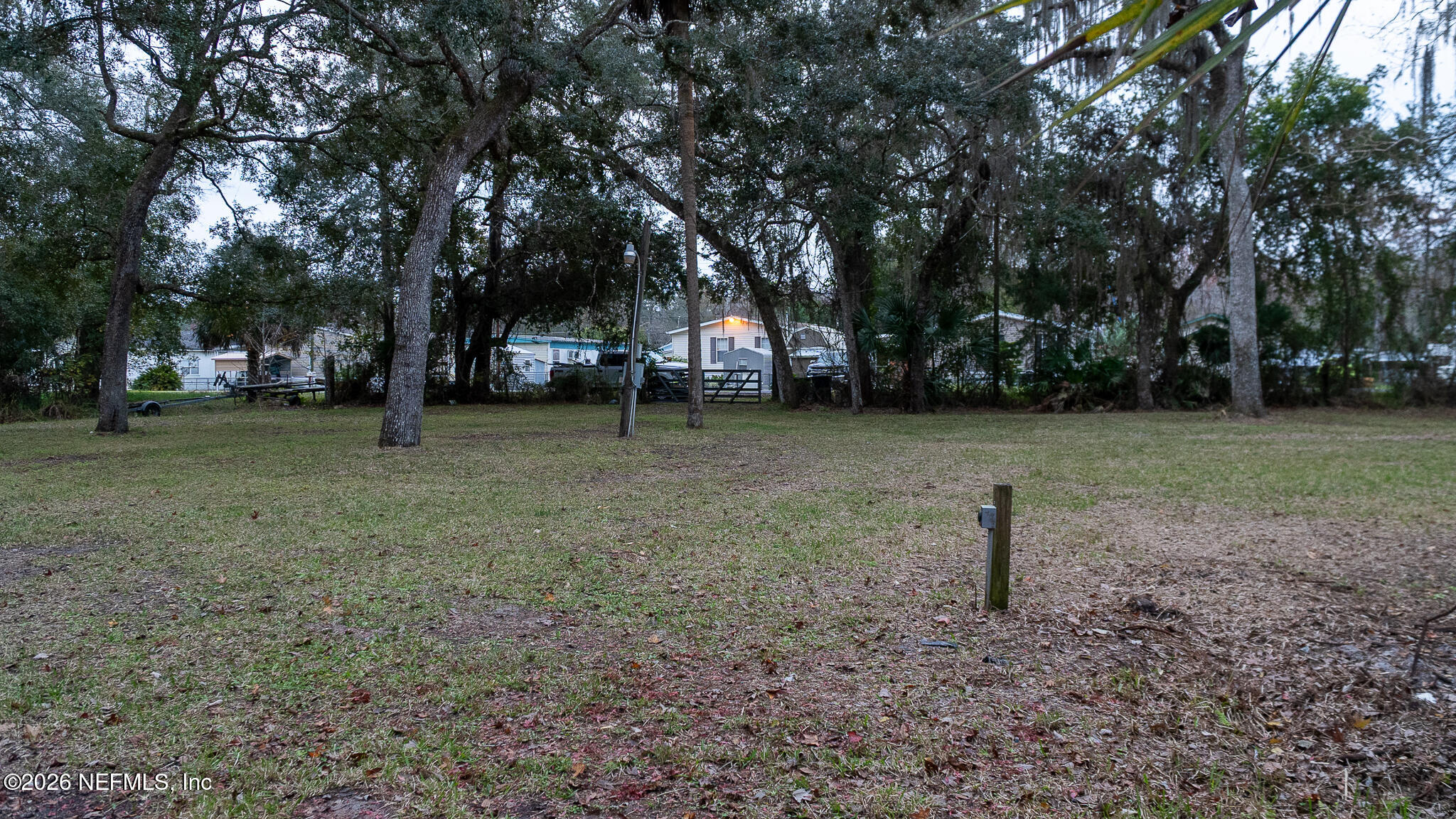 155 Fran Lane Satsuma, FL 32189 - Photo 9 of 32 a backyard of a house with lots of green space