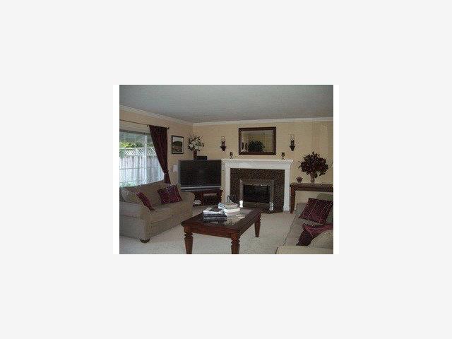 668 Hamann Drive San Jose, CA 95117 - Photo 4 of 8 a living room with furniture and a fireplace