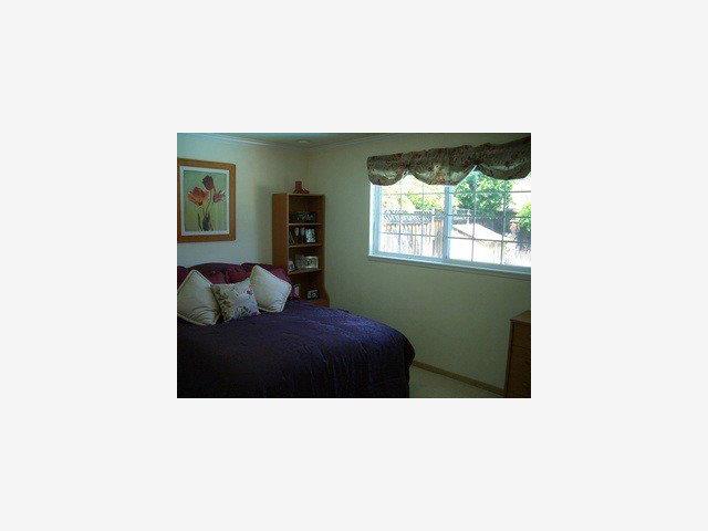 668 Hamann Drive San Jose, CA 95117 - Photo 6 of 8 a living room with a couch and a window